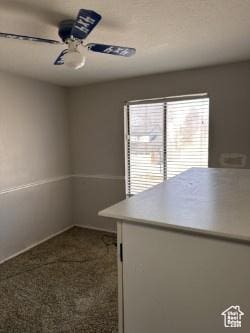 interior space featuring a ceiling fan