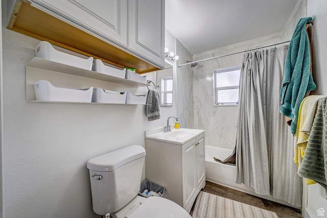 full bathroom with toilet, shower / bath combo, and a sink