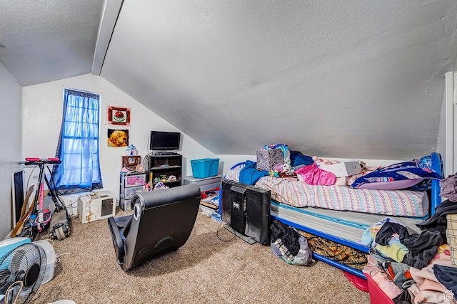 carpeted bedroom featuring a textured ceiling and vaulted ceiling