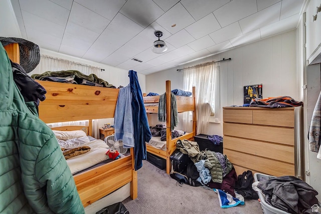 bedroom featuring visible vents and carpet