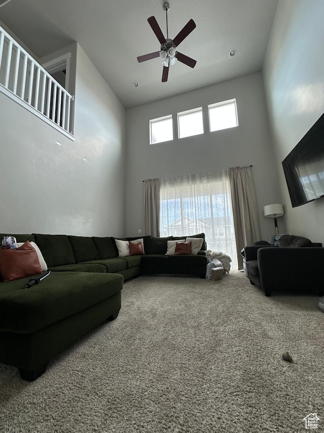 4929 W Red Ruby Ln, Herriman, UT 84096 - living room featuring carpet floors, a ceiling fan, and a towering ceiling