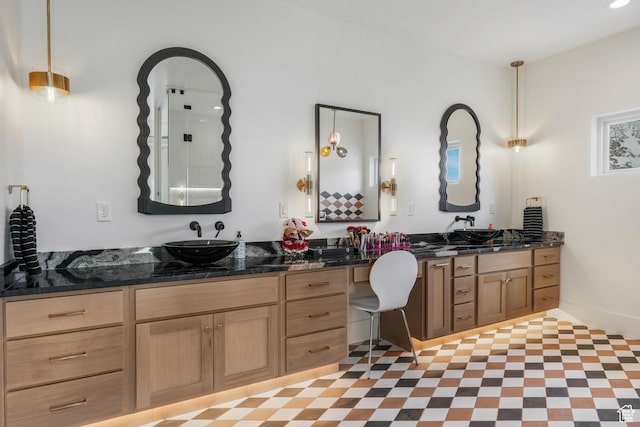full bath with vanity and tile patterned floors