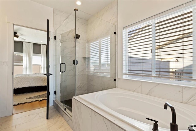 ensuite bathroom with connected bathroom, a stall shower, a bath, marble finish floor, and a ceiling fan