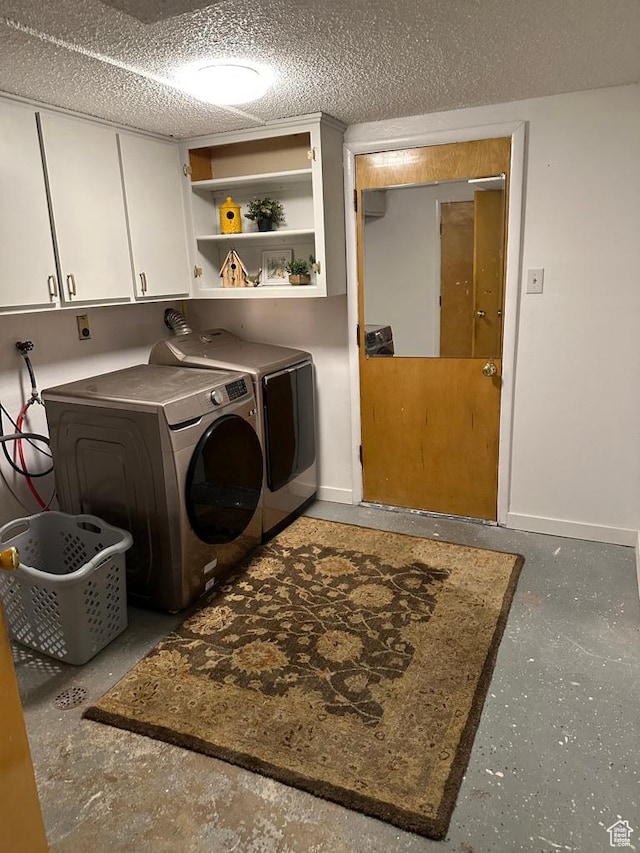1653 S 500 E, Bountiful, UT 84010 - laundry area featuring cabinet space, washer and dryer, and baseboards