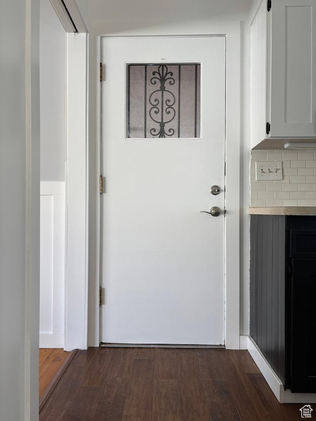 entryway with dark wood-style flooring