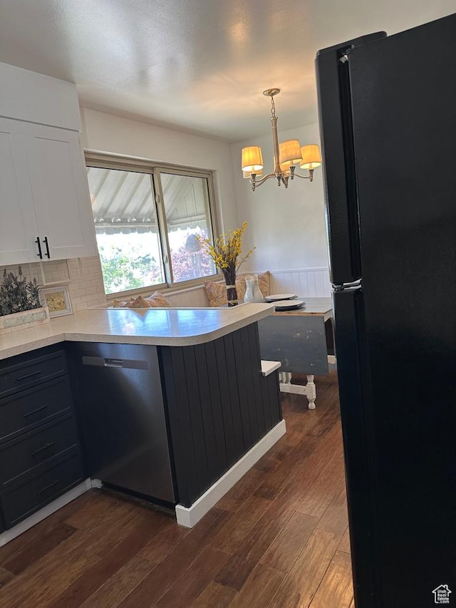1653 S 500 E, Bountiful, UT 84010 - kitchen with freestanding refrigerator, dishwasher, white cabinets, dark wood finished floors, and a peninsula