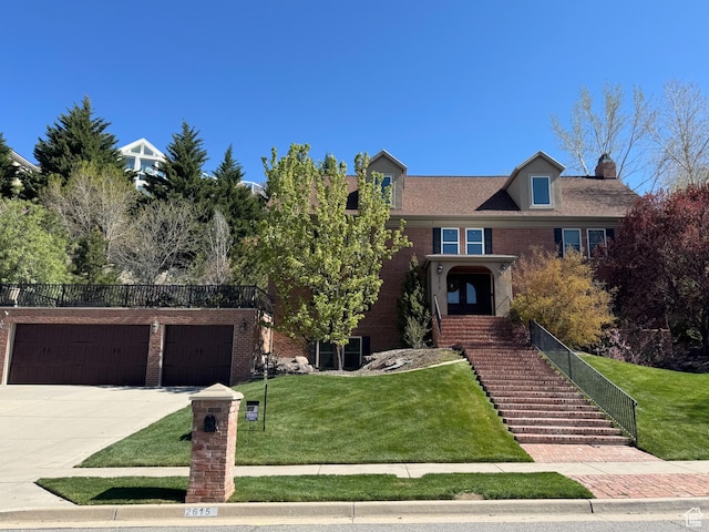 2615 E Chalet Cir, Cottonwood Heights, UT 84093 - traditional-style house with brick siding, driveway, and a front lawn