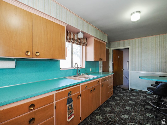 1325 E Milne Ln S, Cottonwood Heights, UT 84047 - kitchen featuring wallpapered walls, light countertops, brown cabinetry, and a sink