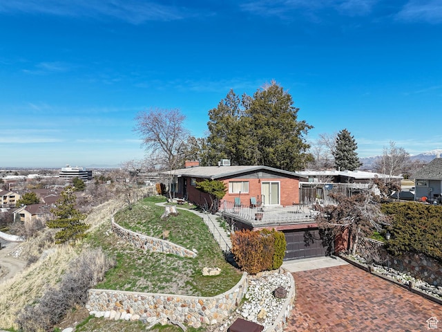 1325 E Milne Ln S, Cottonwood Heights, UT 84047 - view of front of property featuring decorative driveway, brick siding, and an attached garage