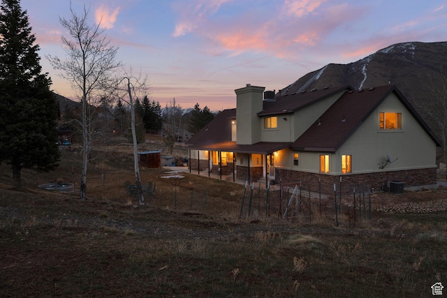 1762 S Hobblecreek Haven Rd, Springville, UT 84663 - back of property at dusk with a chimney and a mountain view
