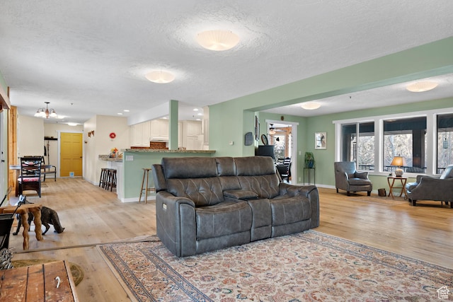 1762 S Hobblecreek Haven Rd, Springville, UT 84663 - living area featuring light wood-style flooring and a textured ceiling