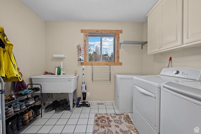 1762 S Hobblecreek Haven Rd, Springville, UT 84663 - laundry room with cabinet space, washing machine and dryer, and light tile patterned flooring