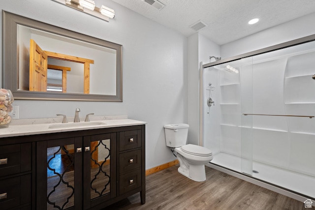1762 S Hobblecreek Haven Rd, Springville, UT 84663 - bathroom with wood finished floors, vanity, a stall shower, and a textured ceiling