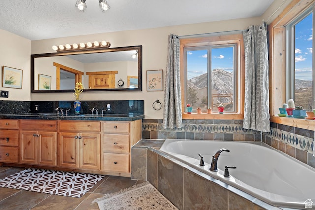 1762 S Hobblecreek Haven Rd, Springville, UT 84663 - full bath featuring vanity, a garden tub, and a textured ceiling