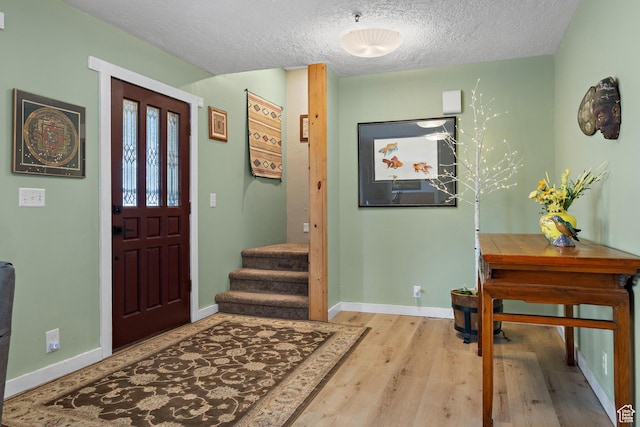 1762 S Hobblecreek Haven Rd, Springville, UT 84663 - entrance foyer with wood finished floors, a textured ceiling, and stairway