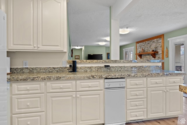 1762 S Hobblecreek Haven Rd, Springville, UT 84663 - kitchen with white cabinets, light stone counters, light wood-type flooring, and a textured ceiling
