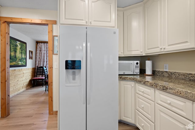 1762 S Hobblecreek Haven Rd, Springville, UT 84663 - kitchen featuring white appliances, light wood finished floors, stone counters, and white cabinetry