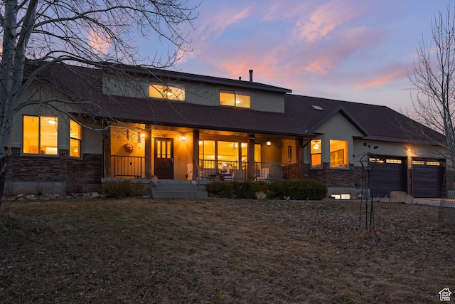 1762 S Hobblecreek Haven Rd, Springville, UT 84663 - view of front facade with stone siding, stucco siding, a porch, and an attached garage
