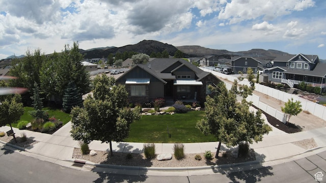 13862 S 7300 W, Herriman, UT 84096 - view of front of property featuring a residential view, a mountain view, concrete driveway, and an attached garage