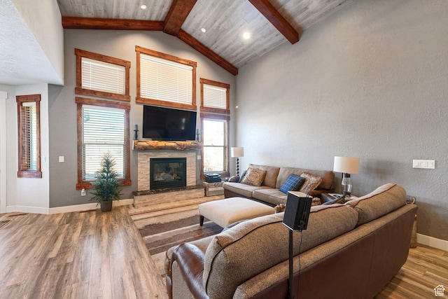 13862 S 7300 W, Herriman, UT 84096 - living room featuring wood finished floors, beamed ceiling, a fireplace, plenty of natural light, and high vaulted ceiling