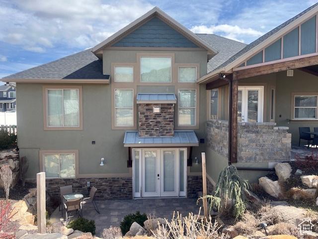13862 S 7300 W, Herriman, UT 84096 - rear view of property featuring stone siding, stucco siding, french doors, and a patio