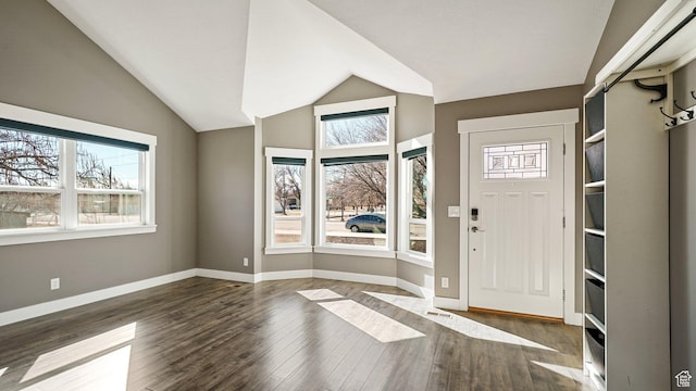 entrance foyer with baseboards, lofted ceiling, and wood finished floors