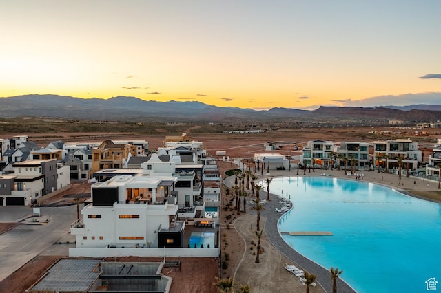 864 W Sapphire Sky Ln Unit 546, St George, UT 84790 - aerial view at dusk featuring a mountain view and a residential view