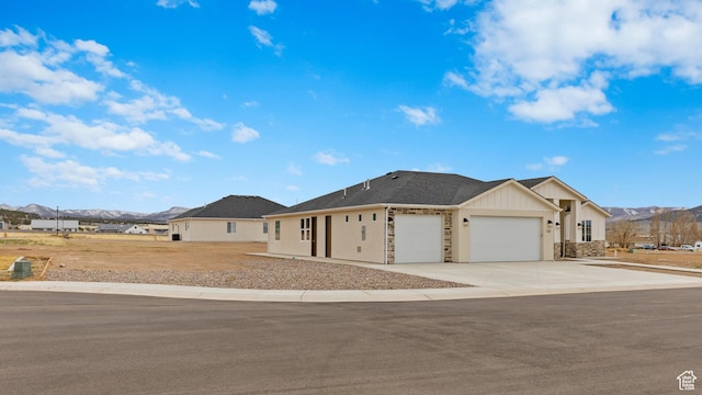 810 E 150 S, Enterprise, UT 84725 - ranch-style home featuring an attached garage, a mountain view, driveway, and board and batten siding