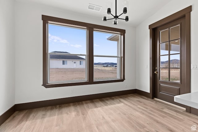 810 E 150 S, Enterprise, UT 84725 - unfurnished dining area with a chandelier, healthy amount of natural light, and light wood finished floors