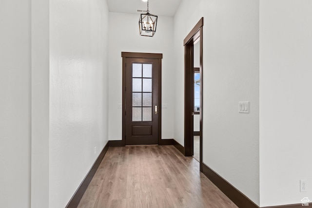 810 E 150 S, Enterprise, UT 84725 - doorway with a chandelier, wood finished floors, and baseboards