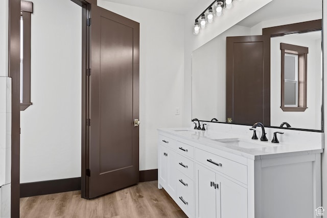 810 E 150 S, Enterprise, UT 84725 - full bath featuring wood finished floors, double vanity, and baseboards