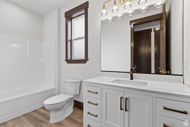 810 E 150 S, Enterprise, UT 84725 - full bath with wood finished floors, toilet, vanity, shower / washtub combination, and baseboards