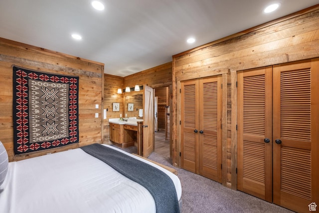 8840 N The Unit 37, Sundance, UT 84604 - bedroom with wooden walls, recessed lighting, carpet, and multiple closets