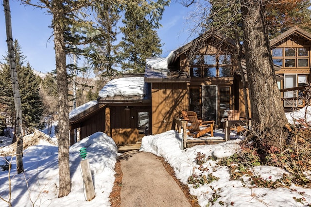 8840 N The Unit 37, Sundance, UT 84604 - snow covered property with board and batten siding