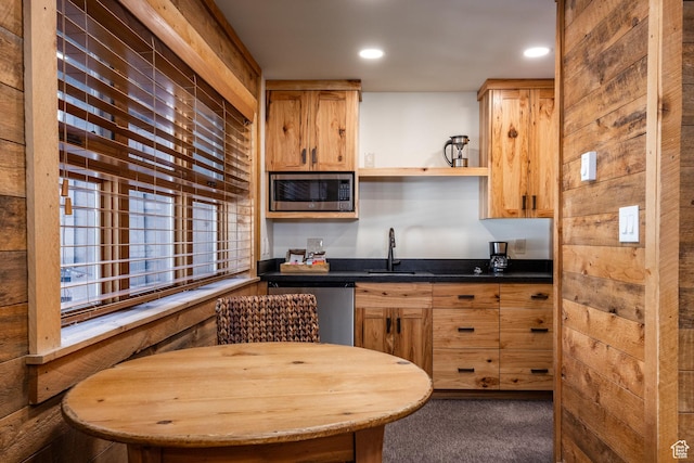 8840 N The Unit 37, Sundance, UT 84604 - kitchen with dark countertops, carpet floors, recessed lighting, appliances with stainless steel finishes, and a sink