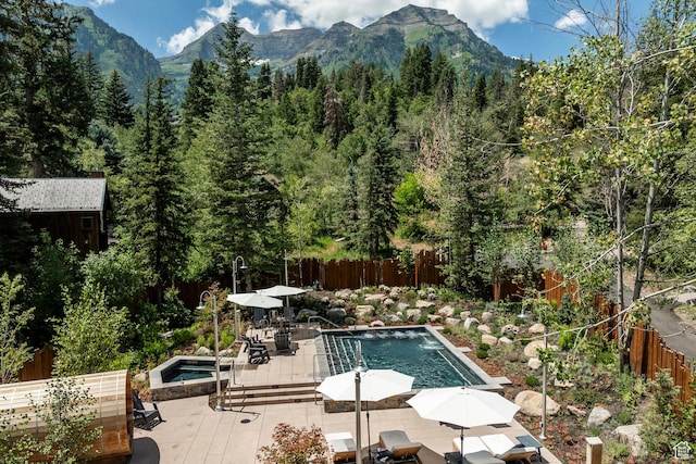 8840 N The Unit 37, Sundance, UT 84604 - view of pool with outdoor dining space, a fenced in pool, and fence