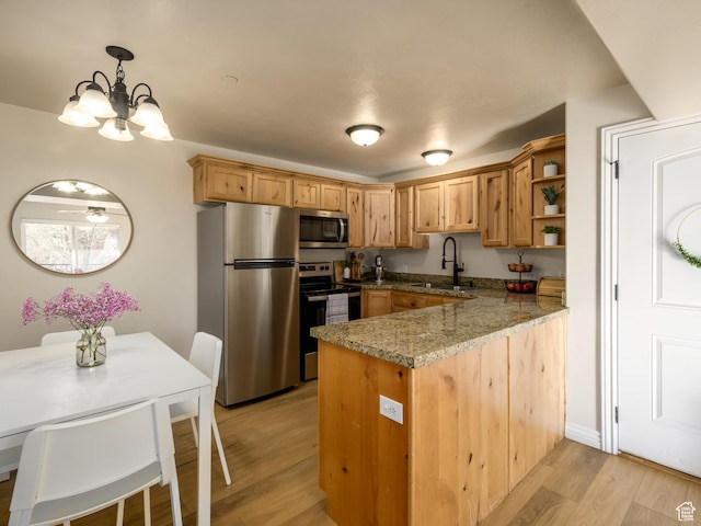 336 S 930 W Unit 203, Pleasant Grove, UT 84062 - kitchen featuring a peninsula, stainless steel appliances, light wood-style floors, and a sink