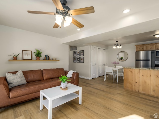 336 S 930 W Unit 203, Pleasant Grove, UT 84062 - living room with recessed lighting, visible vents, light wood-style floors, and ceiling fan with notable chandelier