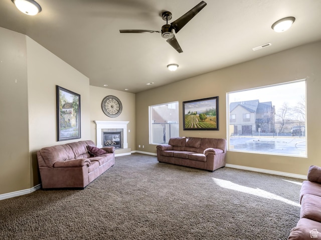 336 S 930 W Unit 203, Pleasant Grove, UT 84062 - carpeted living room featuring visible vents, baseboards, a glass covered fireplace, and a ceiling fan
