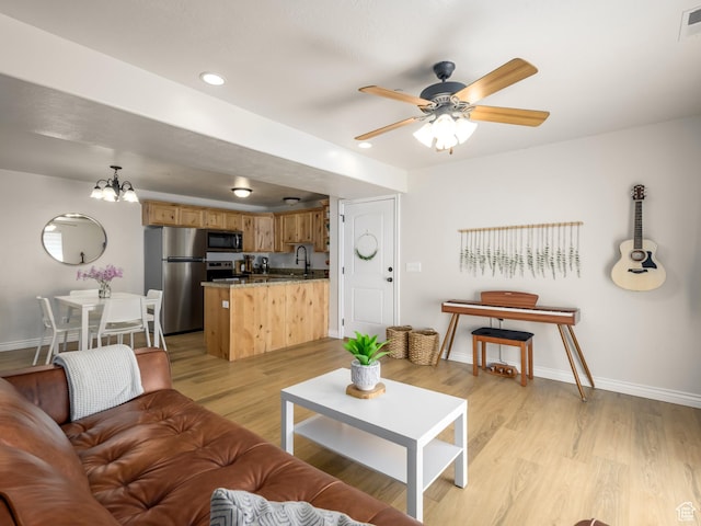 336 S 930 W Unit 203, Pleasant Grove, UT 84062 - living area featuring ceiling fan with notable chandelier, visible vents, light wood-style floors, and baseboards