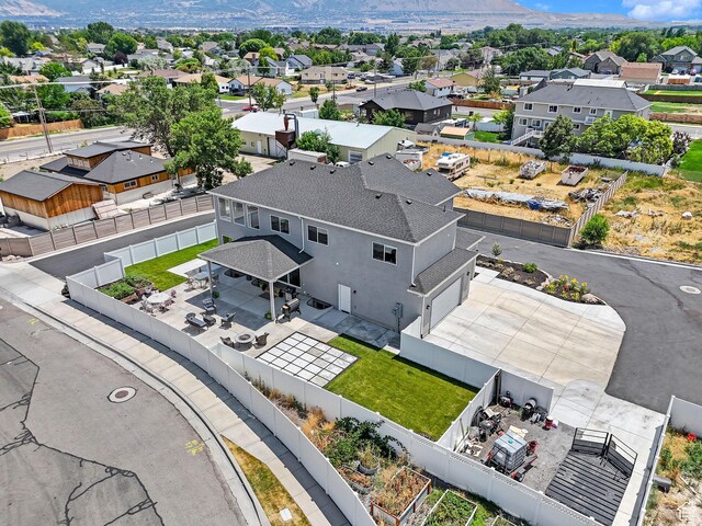 birds eye view of property featuring a mountain view and a residential view