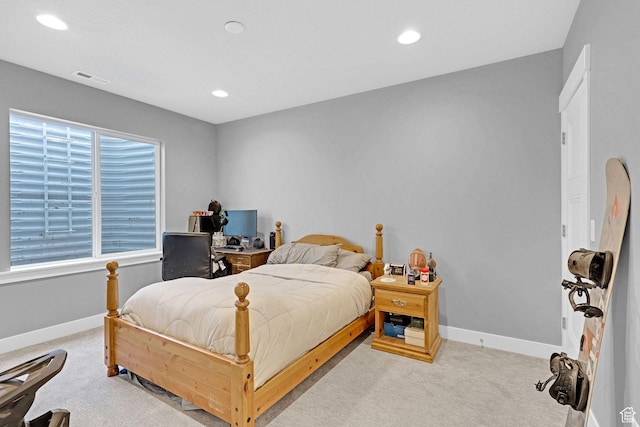 carpeted bedroom featuring recessed lighting, visible vents, and baseboards