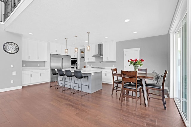 dining area featuring plenty of natural light, dark wood-style floors, and recessed lighting