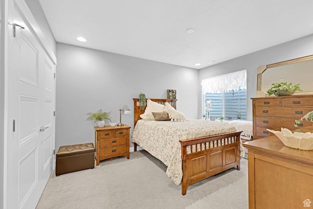 bedroom featuring recessed lighting and light colored carpet