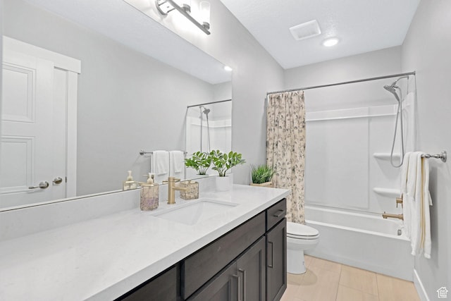 full bathroom featuring vanity, visible vents, tile patterned flooring, shower / bath combination with curtain, and toilet