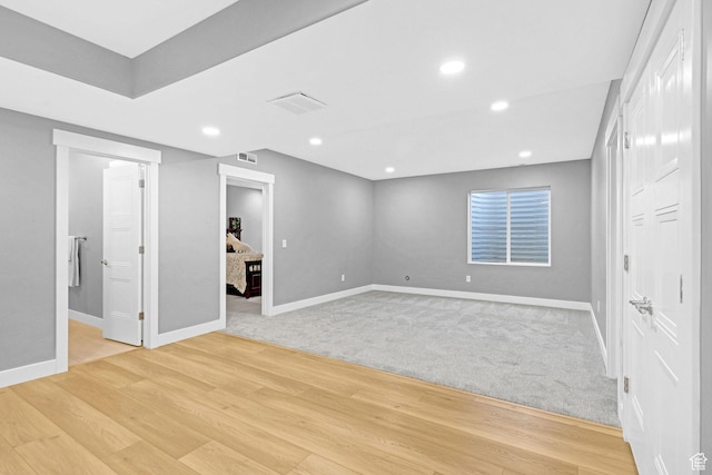 interior space with recessed lighting, visible vents, baseboards, and light wood-style flooring