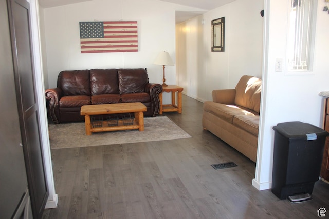 3223 S Nina Loop, Garden City, UT 84028 - living area featuring baseboards, wood finished floors, and vaulted ceiling