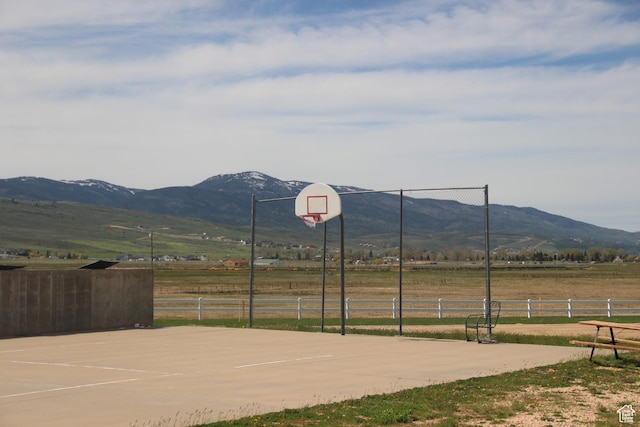 3223 S Nina Loop, Garden City, UT 84028 - exterior space featuring a mountain view, a rural view, community basketball court, and fence