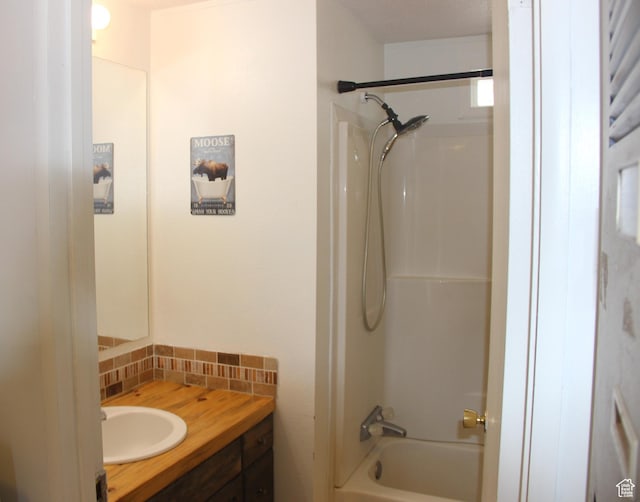 3223 S Nina Loop, Garden City, UT 84028 - full bathroom featuring shower / bathing tub combination, backsplash, and vanity