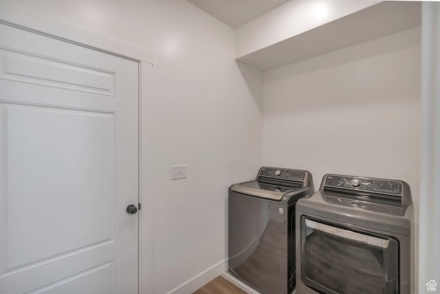 706 W 500 N, Brigham City, UT 84302 - laundry area with baseboards, wood finished floors, laundry area, and washing machine and clothes dryer